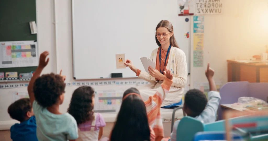 Female teacher showing class cards