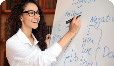 English teacher writing on board